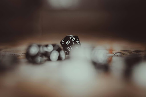 Dice rolled into a 20 with bokeh shots of other dices